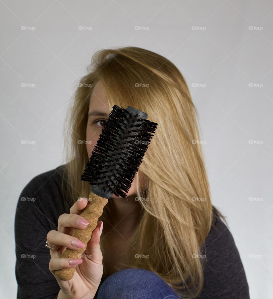 Woman with attitude showing off silky hair 