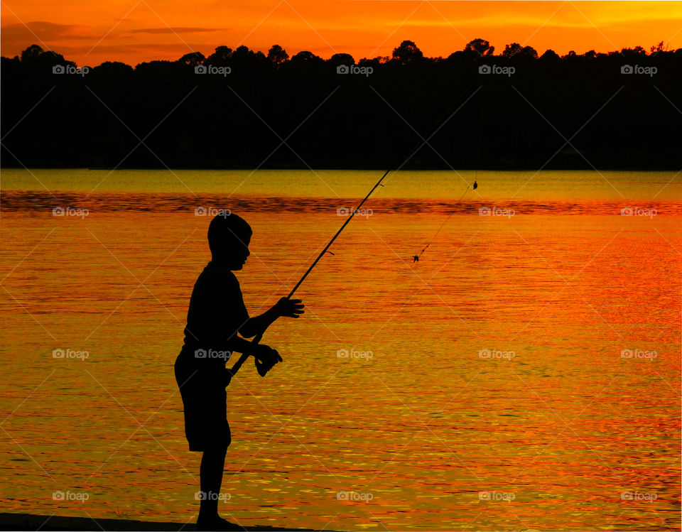 Fishing on the Bayou!
This young gentleman is exercising his fishing ability by baiting,casting and retrieving his fishing line with the catch of the day!