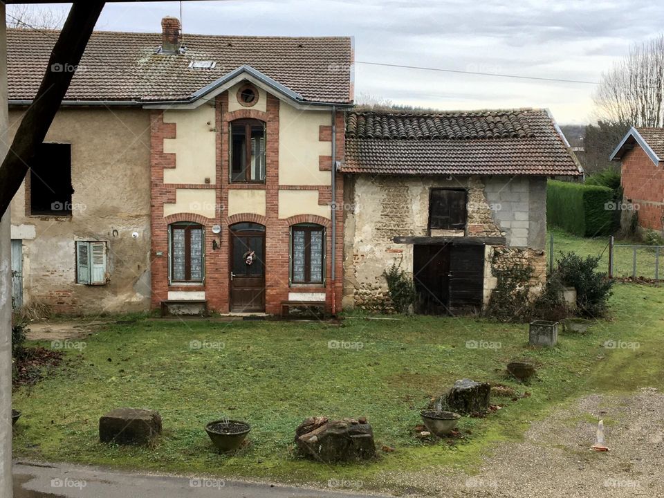 Little houses in rainy countryside 