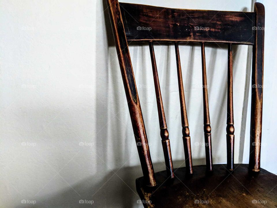 close up of an antique chair with shadow