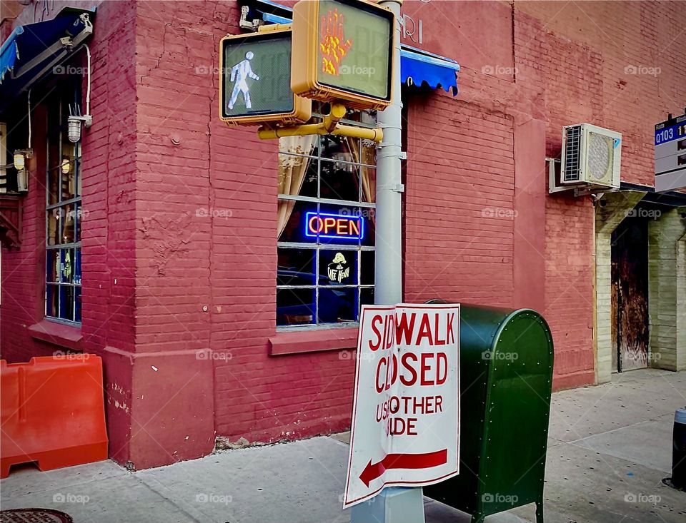 A bar and restaurant on “Vernon Jackson Ave” in LIC, Queens at “Newtown Creek”. The neon sign in the window tells us the establishment is open while the sidewalk that leads to it is currently closed. What to do ? 2022. Hypnotic Productions