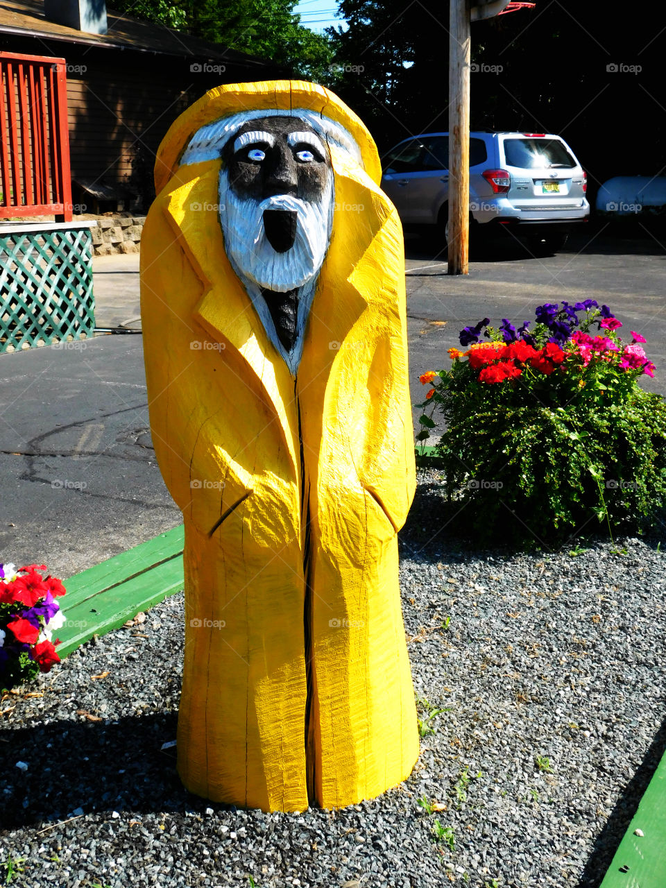 Old man of the sea with yellow rain coat