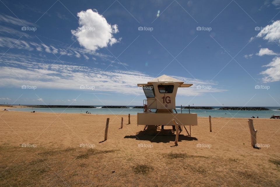 Lifeguard Tower Magic Island. A lifeguard tower on Magic Island near Waikiki. The tranquil lagoon is protected from the surf.