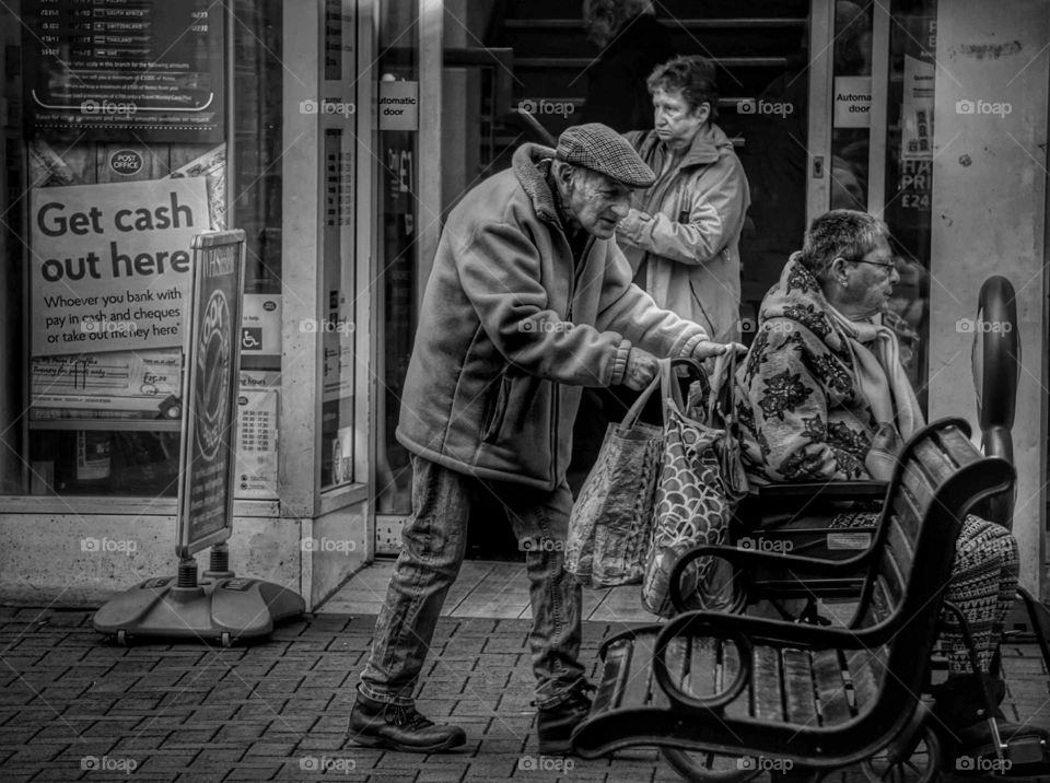 man pushing a wheelchair