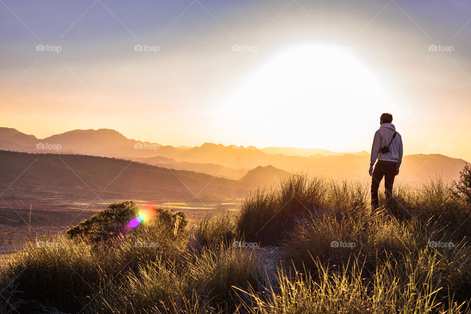 Photographer at a mountaintop in Autumn