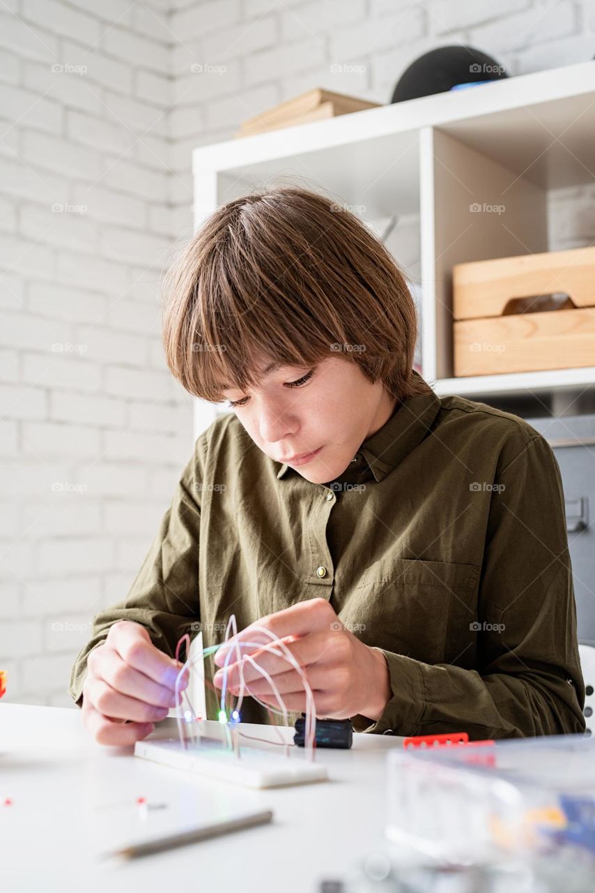 boy working with electricity project