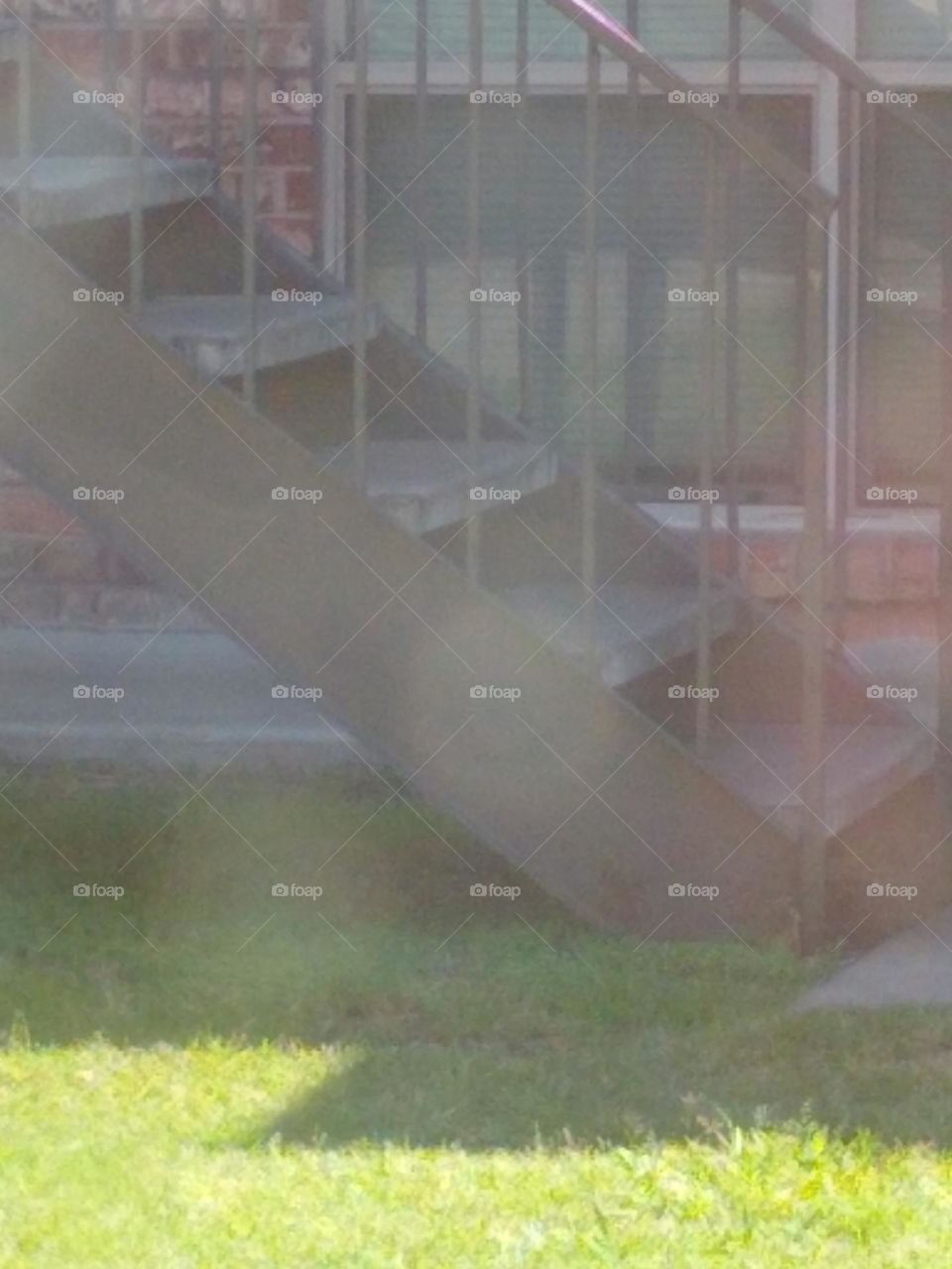 A set of stairs across from my residence within apartment complex.