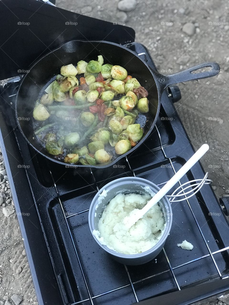 A good ol’ camp dinner. Awaiting a colorful array of sautéed veggies and mashed potatoes to cook to perfection. 