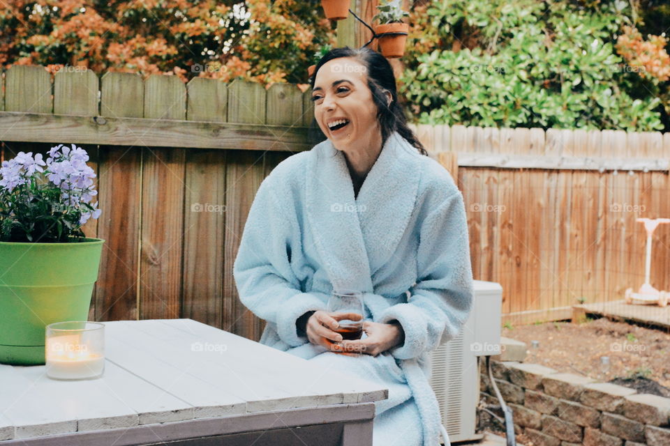 girl in robe laughing