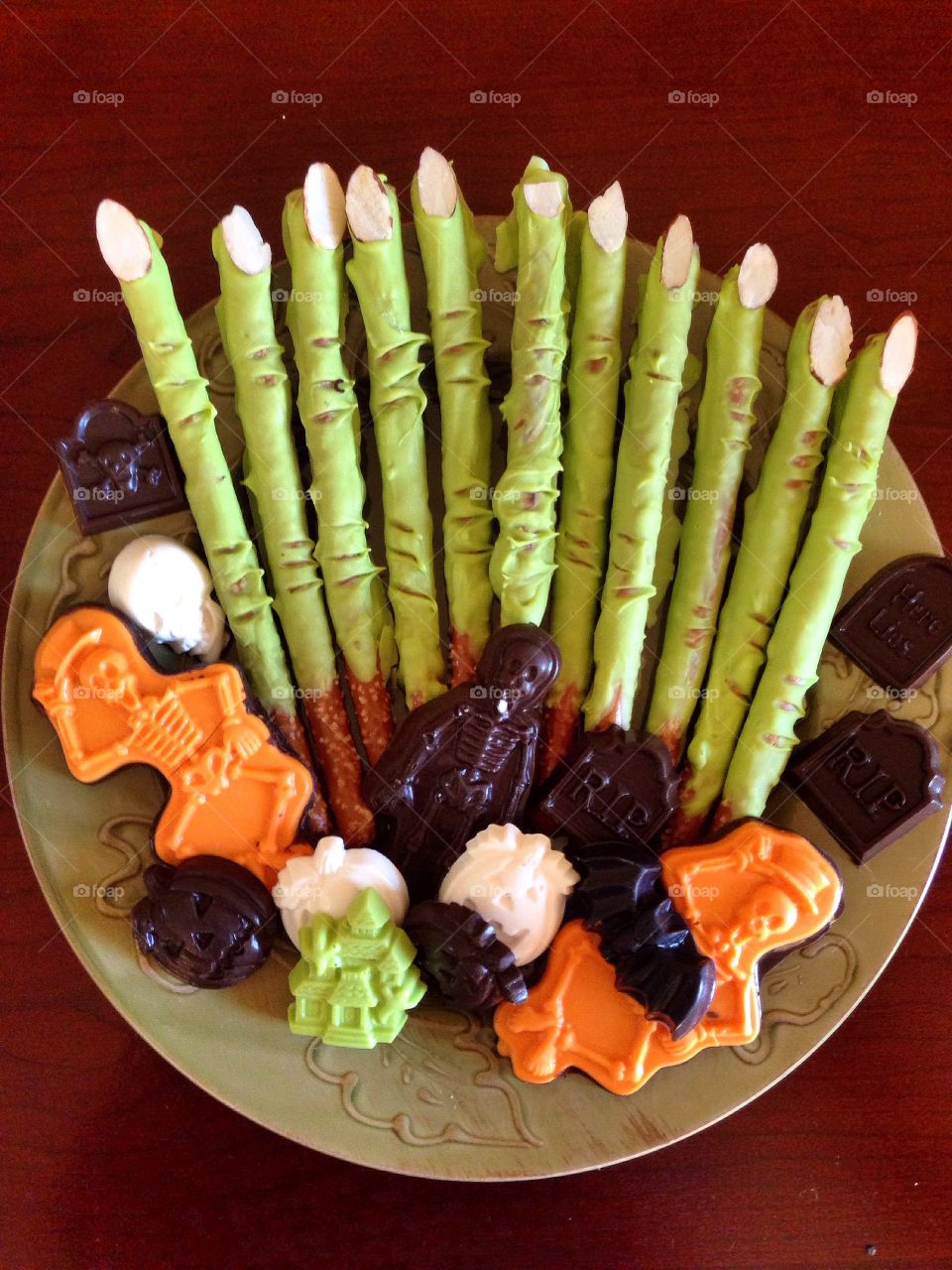 Tasty Halloween treats. Witches fingers made from pretzel rods and assorted chocolate candies. 