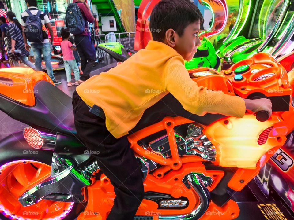 Boy on Toy Bike Ride