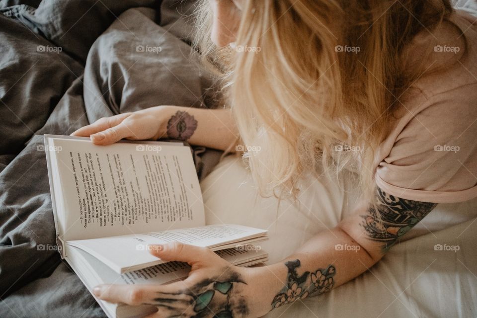 Girl reading in a bed