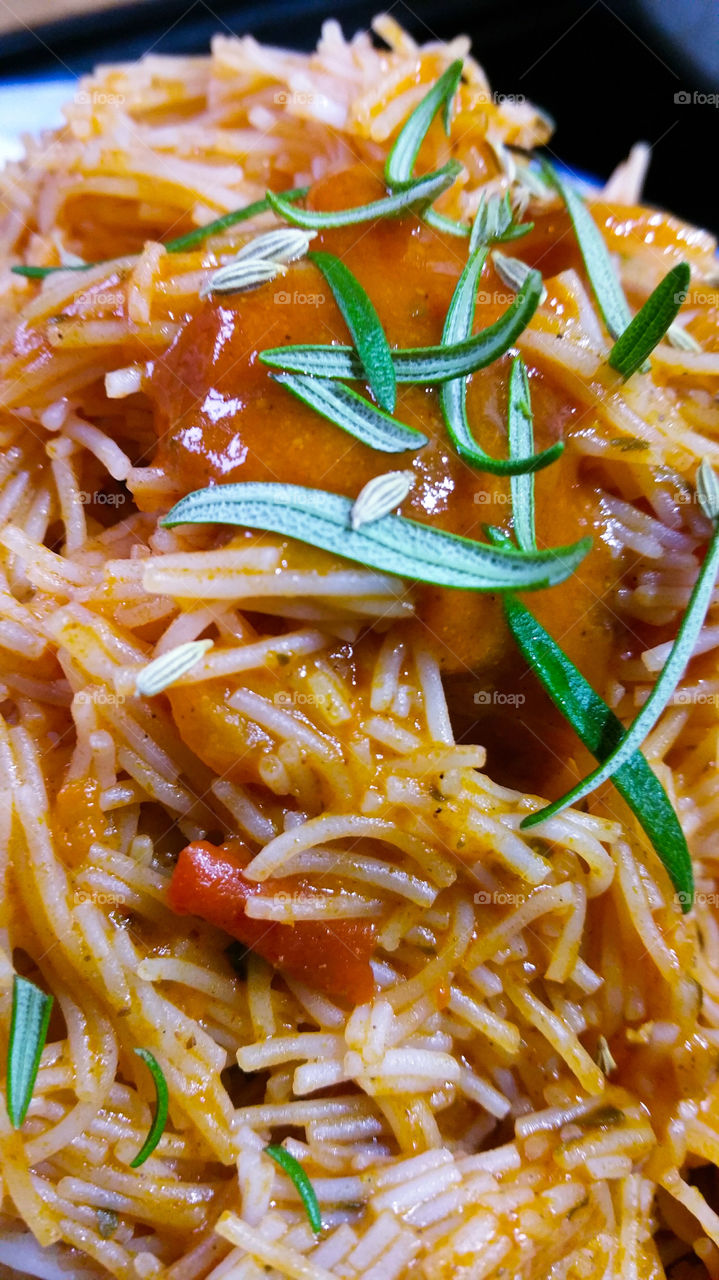 Thin vermicelli with tomato pasta sauce,  rosemary and fennel seed
