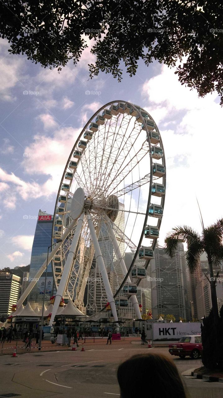 Ferris wheels in the day time at Victoria bay,Hongkong island.