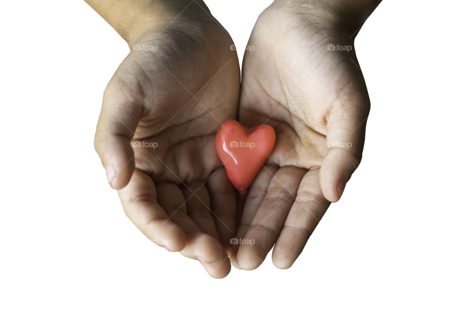 Isolated Hand holding a red candy shape heart on a white background with clipping path.