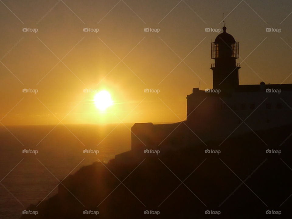 lighthouse and sun