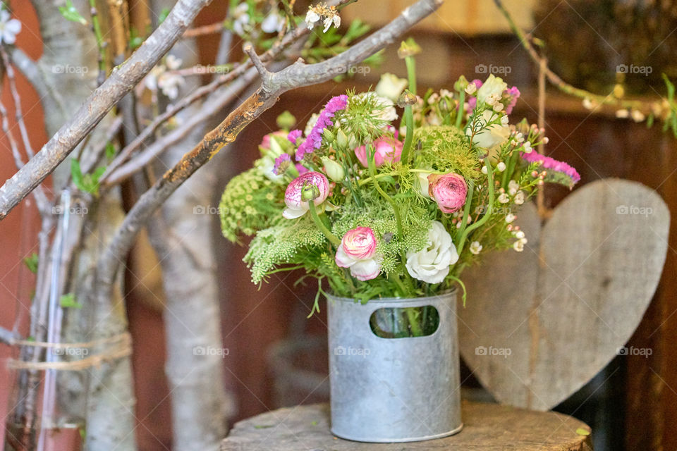 Blooming flowers in metallic can