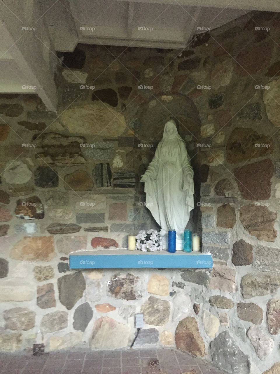Statue of the virgin mary with candles