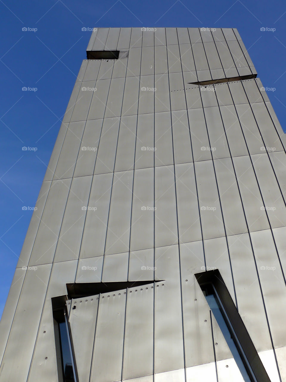 Low angle view of built structure of the Jewish Museum Berlin against clear sky.