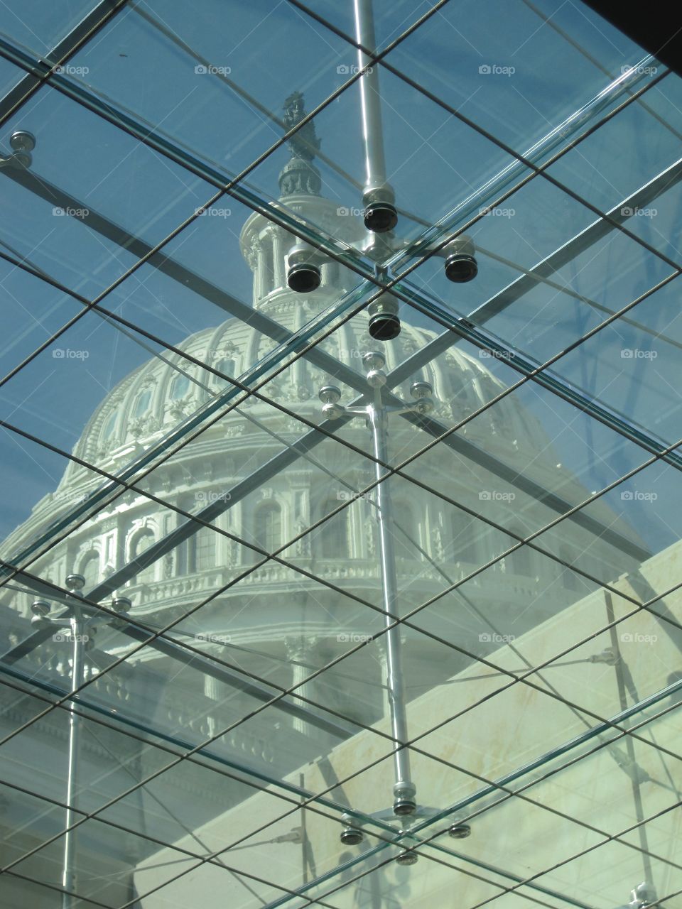 United States Capitol building as seen through visitor center ceiling