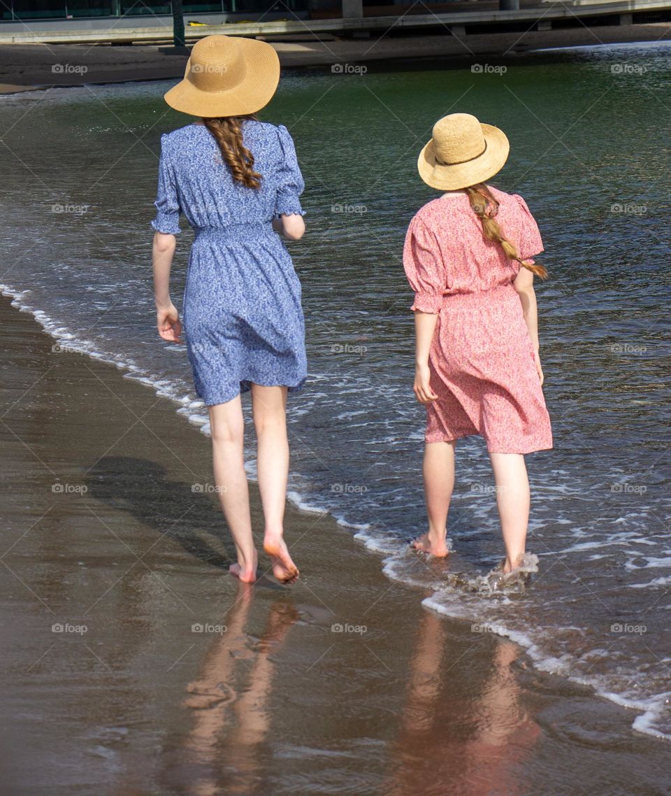 Barefoot at the Beach 
Summer and sun 
two young Girls 
enjoys the day 
at the Beach
