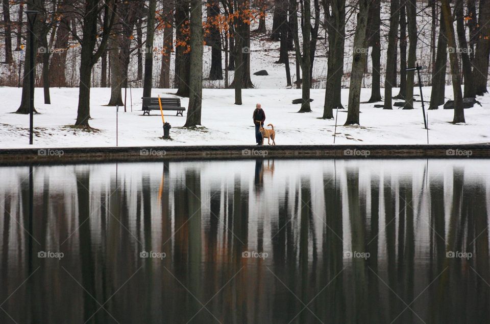 Lady and her dog by lake