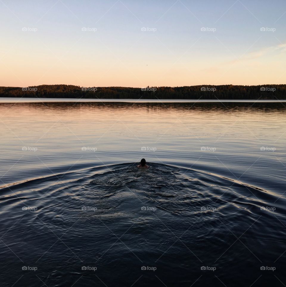 Evening swim in a lake in Lohja, Finland