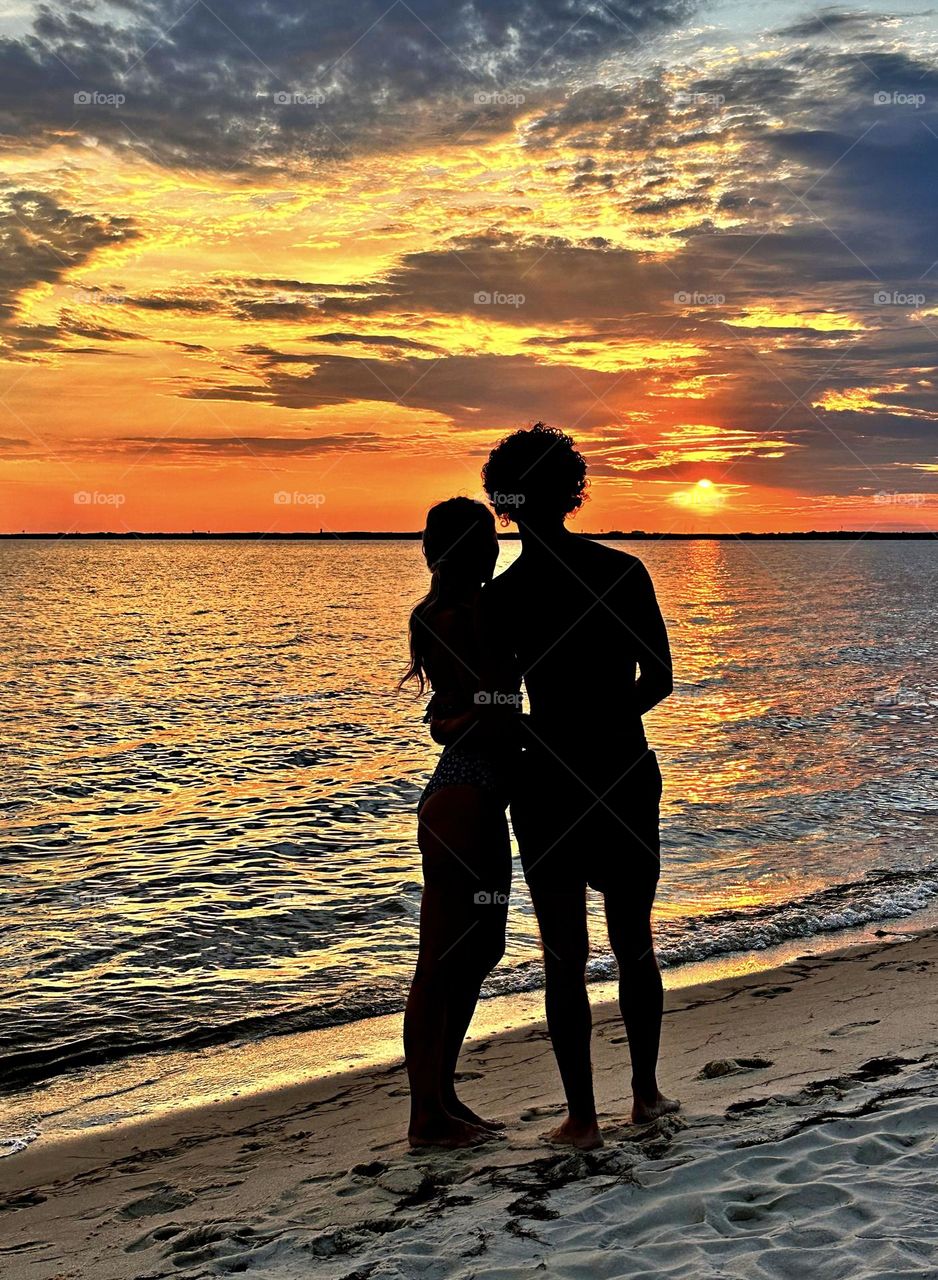 Love on the beach - Magic of the Sunset - The radiance of the beautIful peach colored sky from the descending sunset was glorious to behold and increasing every moment in splendor