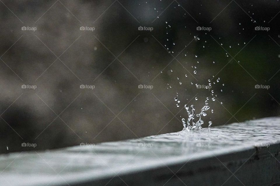 A large splash from a large raindrop