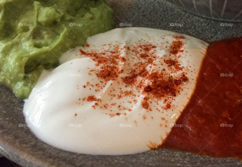 Sour cream, salsa and guacamole. 