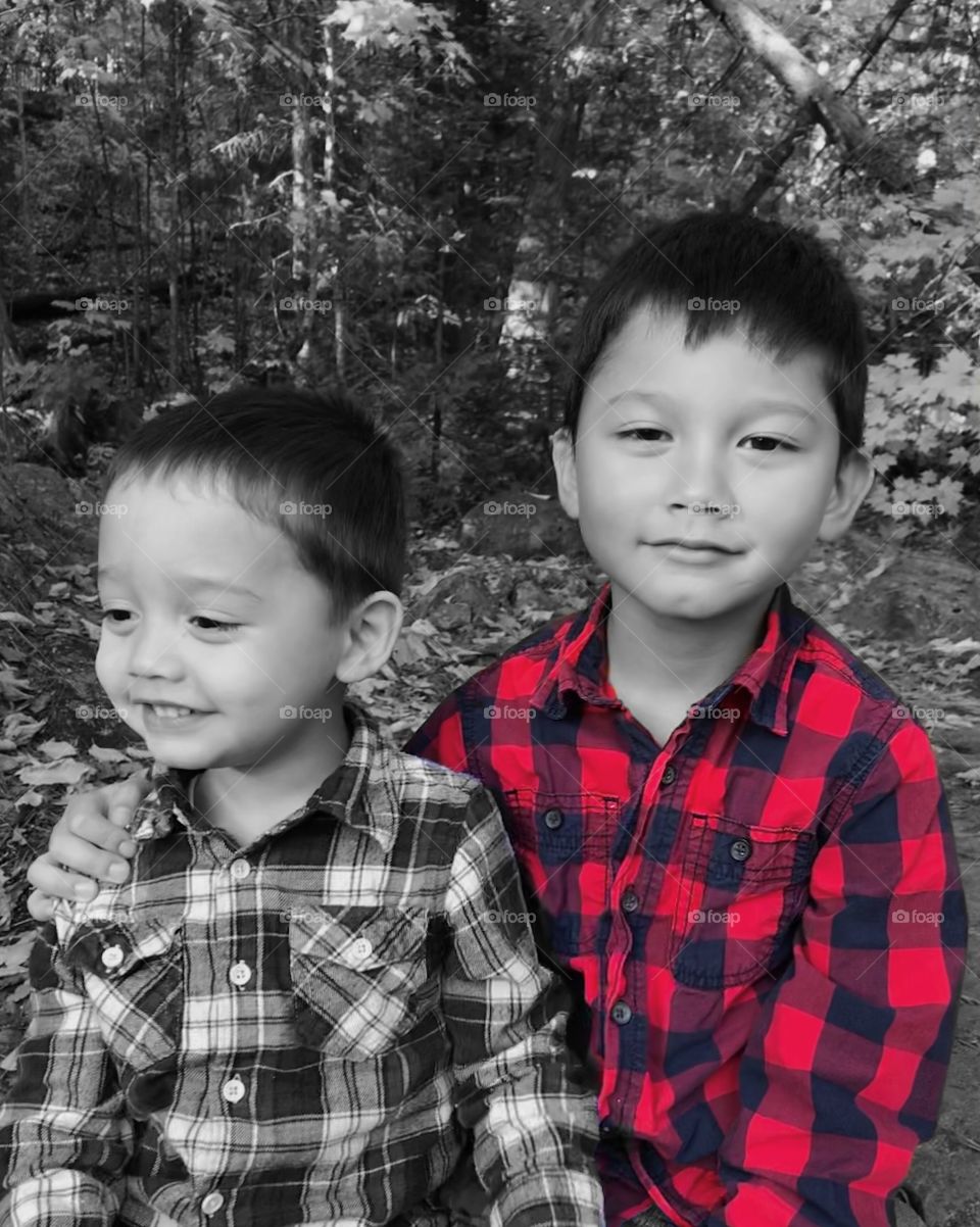 Two brothers in black and white and a splash of red