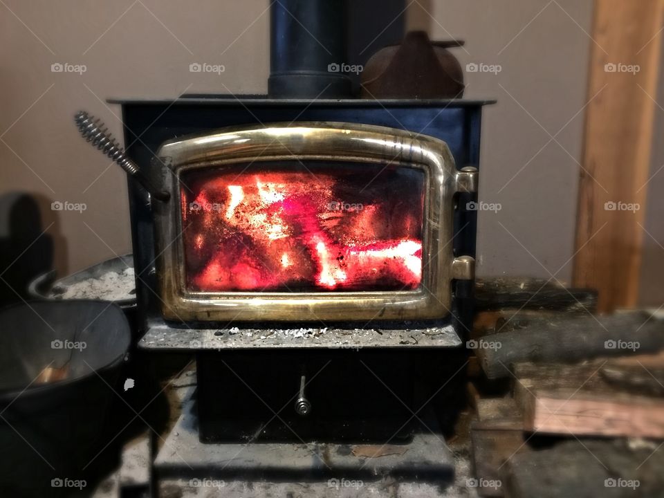 Warm wood stove on a cold fall morning.