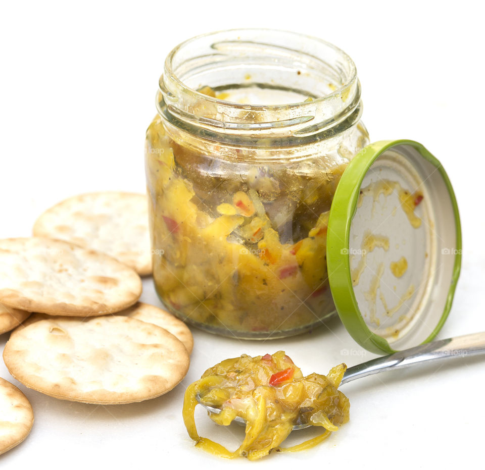 Close-up of mustard pickle with cracker