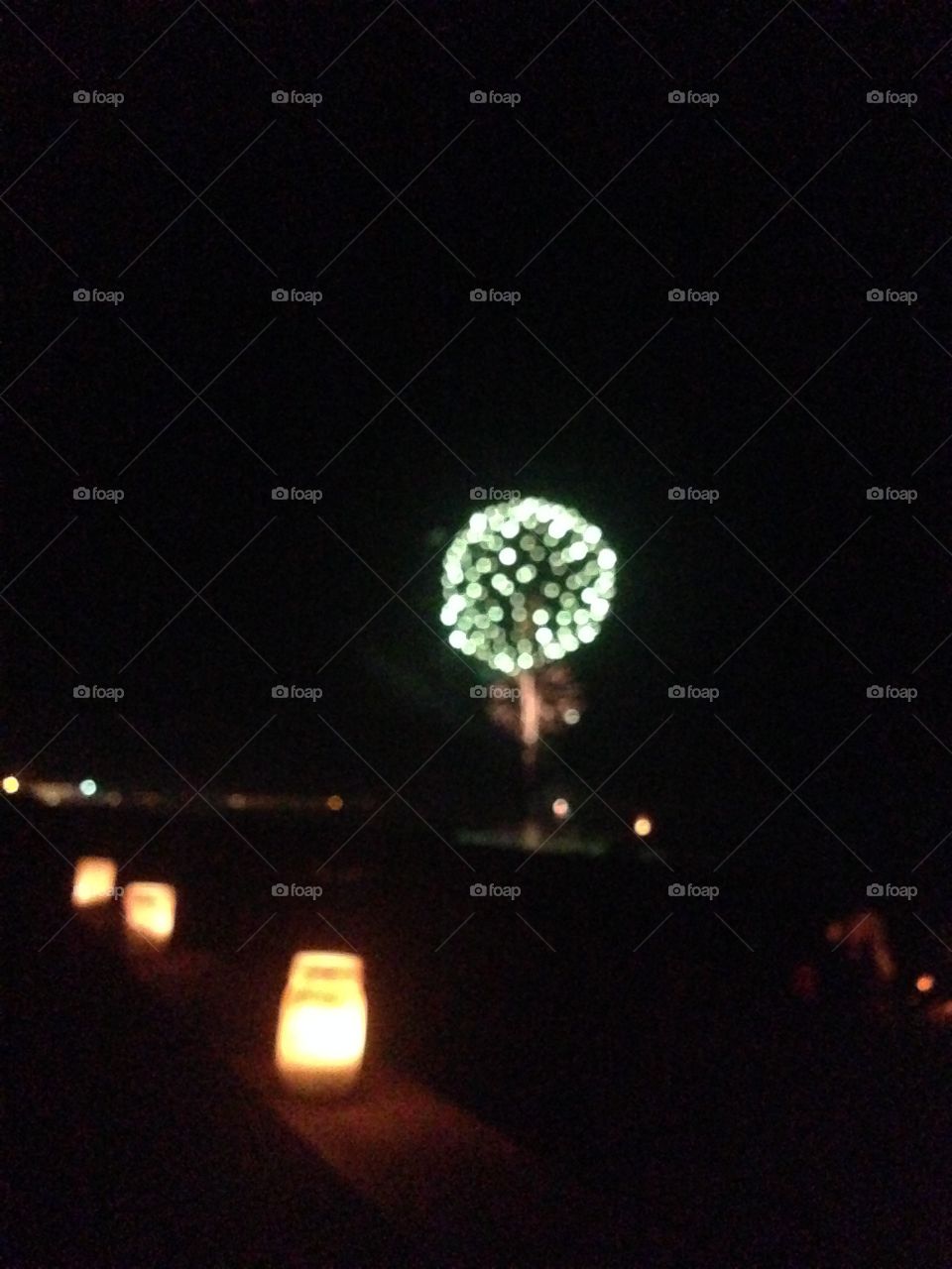 Watching fireworks off the coast of Salisbury Beach, MA, enjoying the Fourth of July celebrations.