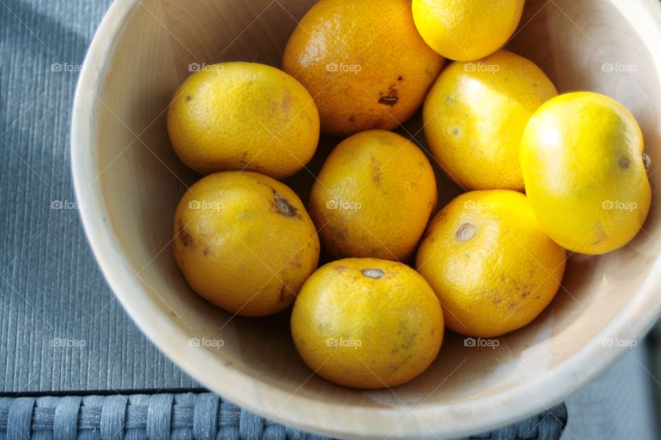 Orange fruits on the woiden bowl 2