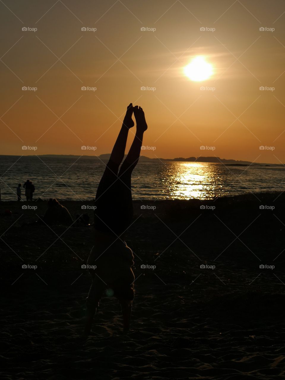 Sunset handstand at the beach