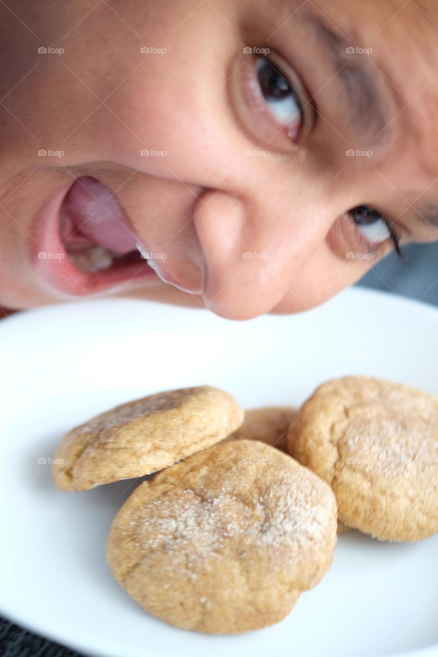 Woman eating cookies, woman with open mouth, woman getting ready to eat snickerdoodles, woman with plate of cookies, snickerdoodle cookies