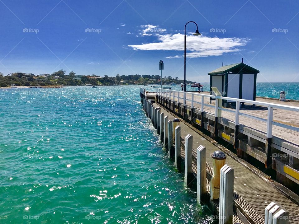 Walking along the Jetty watching the boats
