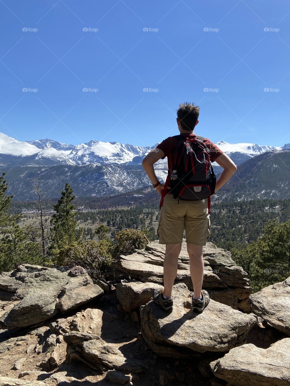 Man looking at mountains 