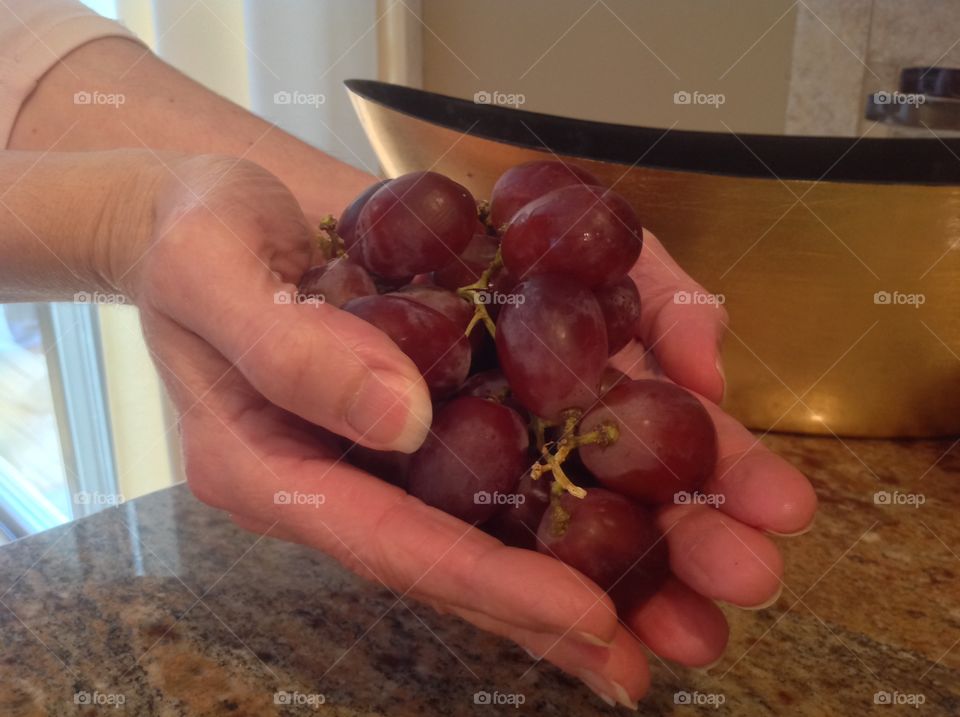 A handful of juicy red grapes.