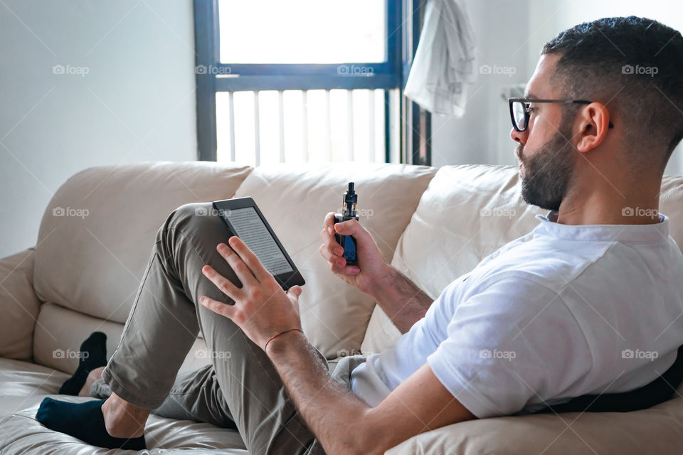 Man smoking while relaxed at home