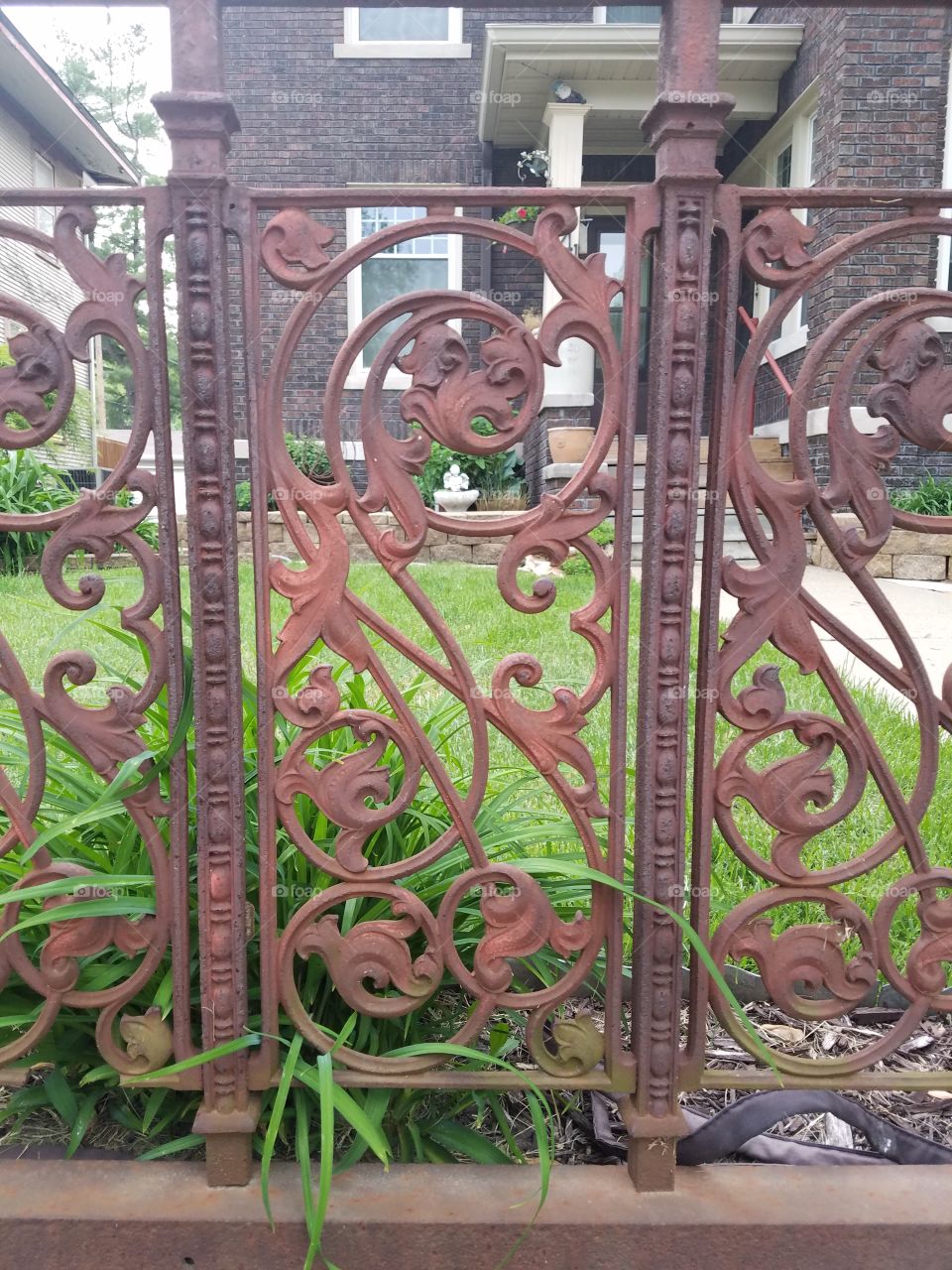 rusty cast iron fence