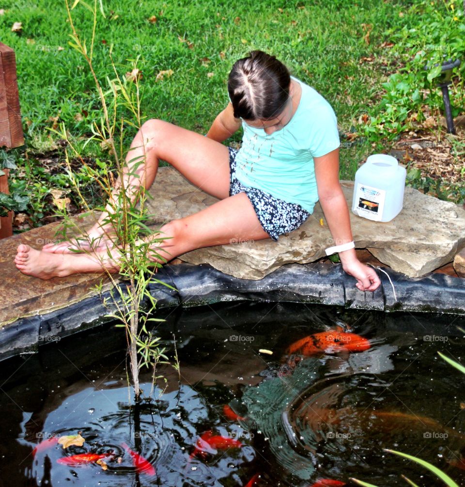 Girl at the pond