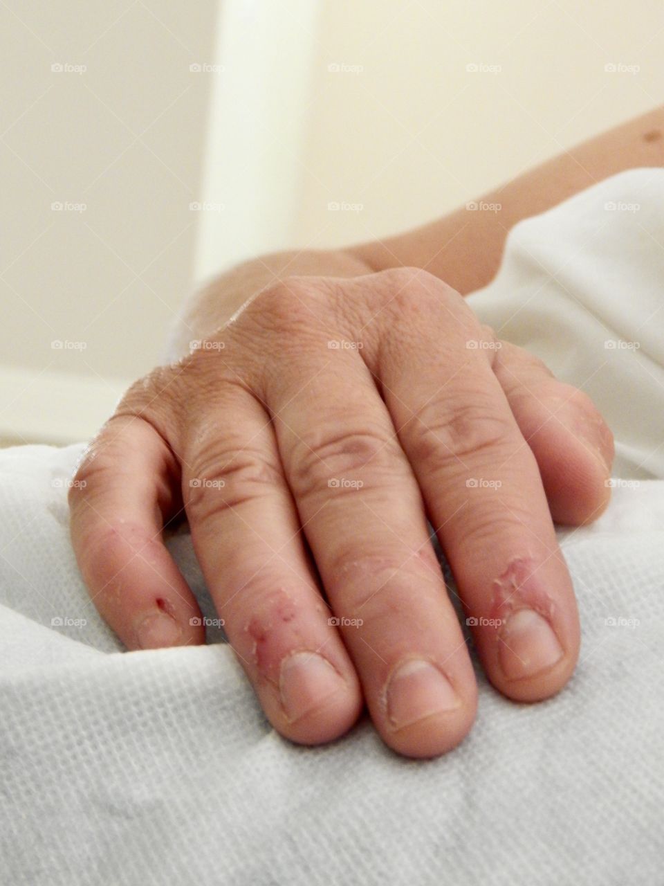 This is my mother. This is the most genuine portrayal of her I've captured through a camera. Some say that if you want to see how much a mother loves you, you look at her hands. All she's ever done is worked hard to the bone for the people she loves. Her hands have spent years and countless hours, creating special events, sewing up clothes, hot glueing projects, typing re-edits, cooking meals, traveling across states, and more. This photo was taken in an empty house before we moved out. She got to rest for an hour or two on an air mattress after stressful months of packing up a home and preparing to start a new life with her four kids due to a divorce. She never asked for much. She never cared about anything more than her family. Everything she did was always to hold her family together & progress in a happy life. She would give the shirt off her back for the people she cares about. She is the hardest worker I've ever come to know with the softest heart I've ever met. She is who I base my life of, who I inspire to be like, and who I try to work just as hard to make life better for her. She doesn't like this photo because she never liked to show negative aspects and you wouldn't guess this stuff through her constant smiles. I think it shows how pure she is even after the hardships she's overcome. This is my mother.