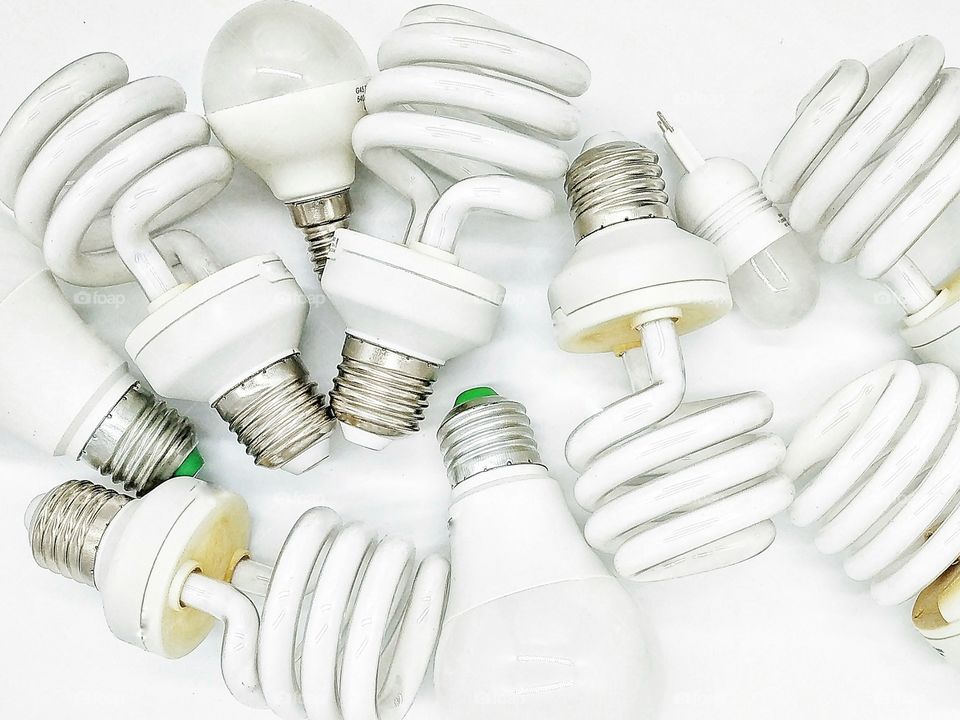 many different type of light bulbs on white background