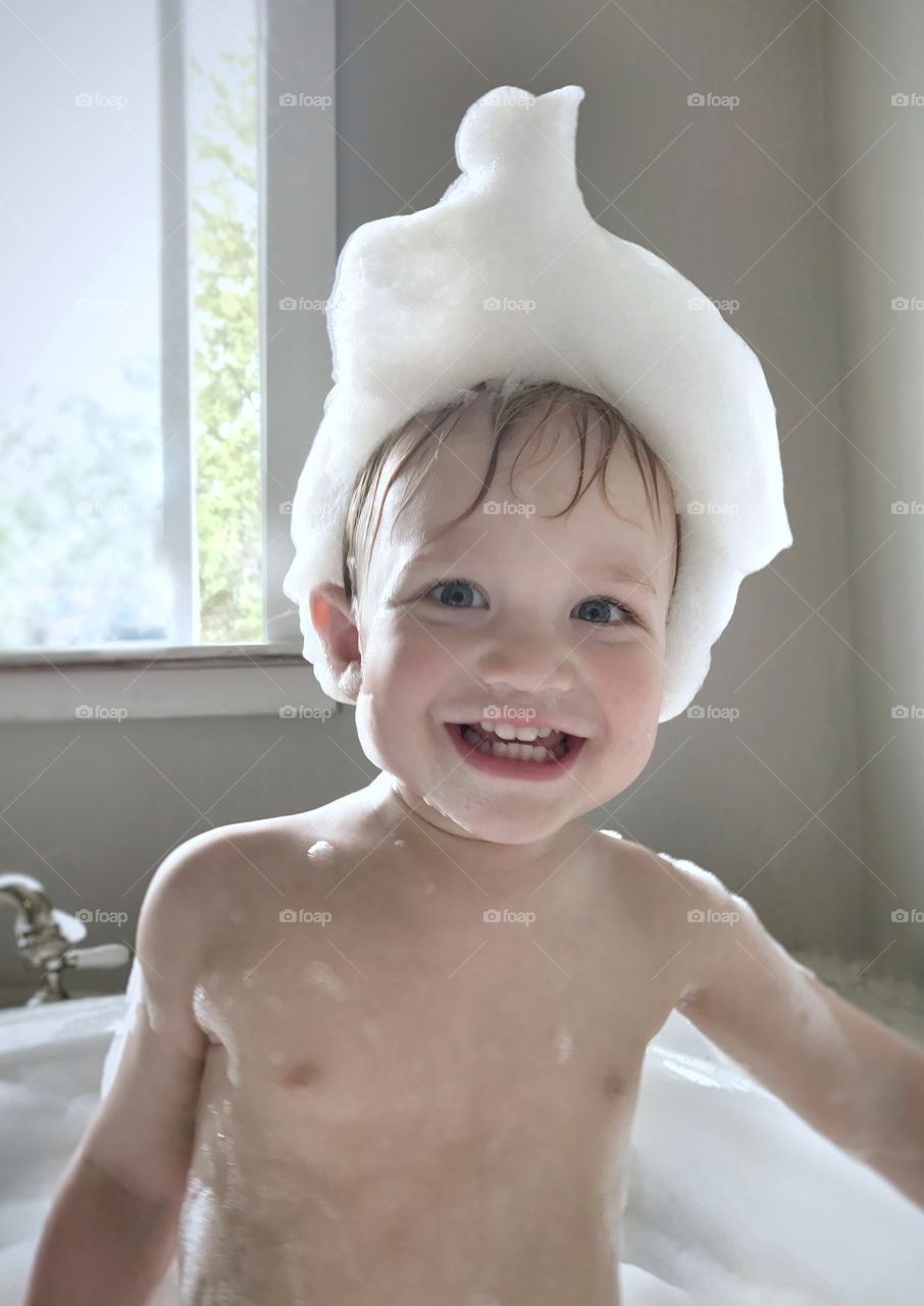 Close-up of a boy in bathtub