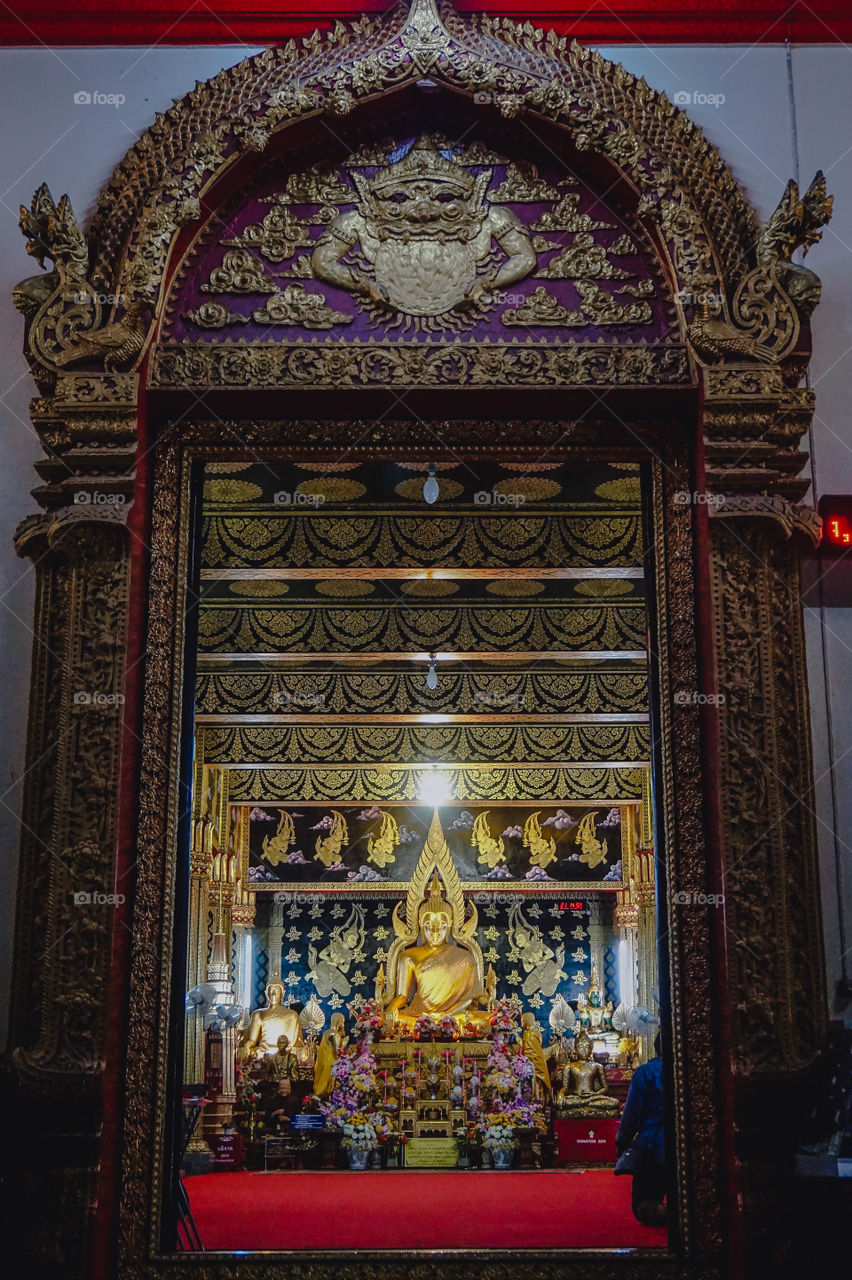Thai Buddhist Temple ornate entry and altar in Chiang Mai, Thailand
