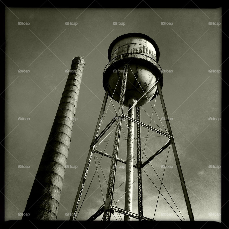 Rustic smoke stack and water tower.
