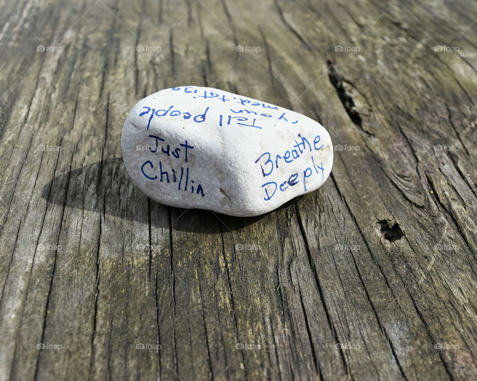 Stone with an affirmation written on it