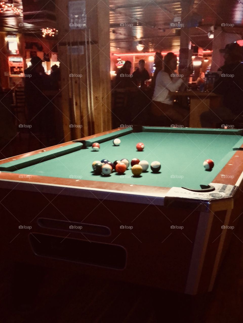 Playing pool at the regular dive bar